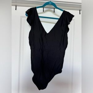 Ruffled shoulder, black bathing suit